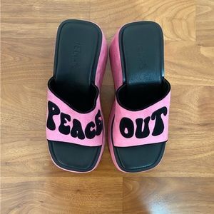 Pink Peace Out platform sandals